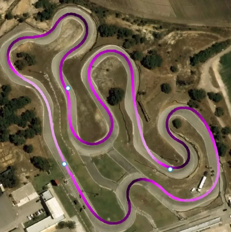 Satellite view of a kart circuit with the recorded racing line traced over the track